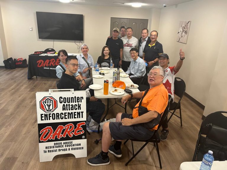 Community members enjoying the BBQ event